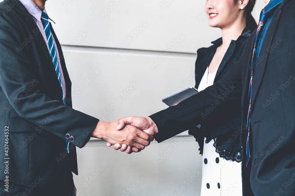 Business people agreement concept. Businessman do handshake with another businessman in the office m