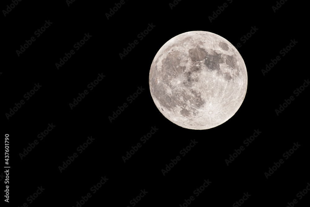 Supermoon over black night sky.May 25, 2021