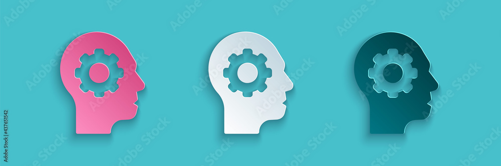 Paper cut Human head with gear inside icon isolated on blue background. Artificial intelligence. Thi