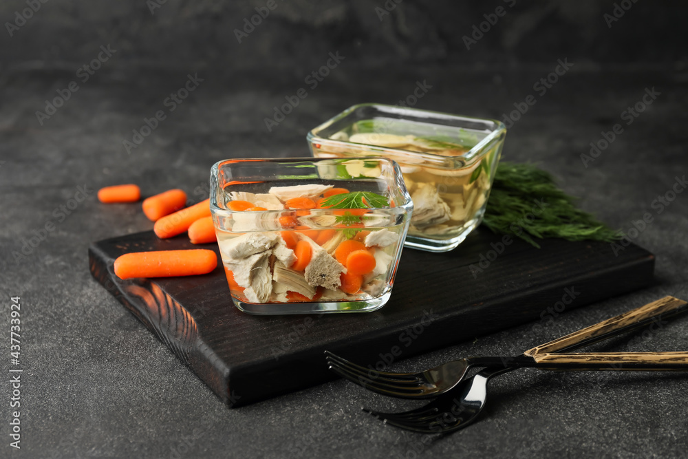 Bowls of tasty aspic on dark background