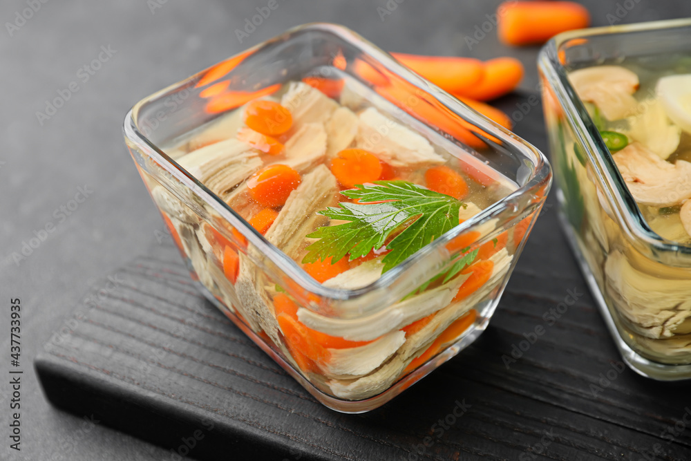 Bowl of tasty aspic on dark background