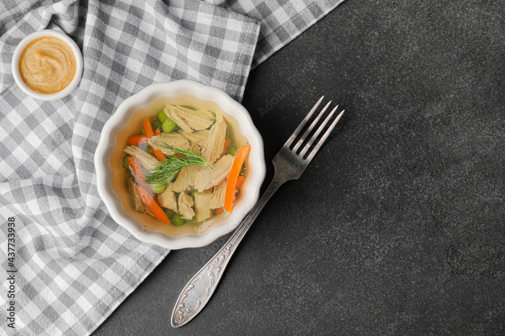 Bowl of tasty aspic on dark background