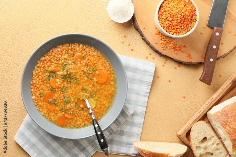 Bowl of tasty lentil soup on table