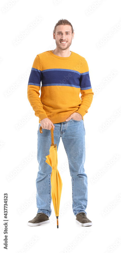 Handsome young man with umbrella on white background