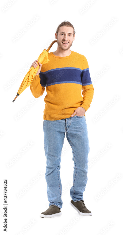 Handsome young man with umbrella on white background