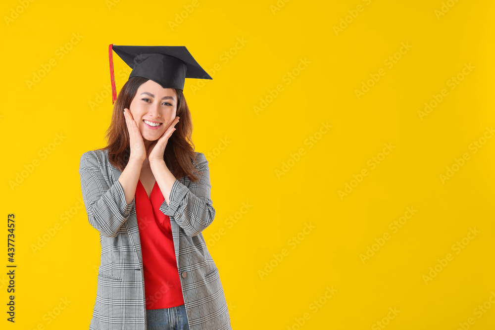 Female graduating student on color background