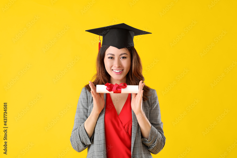 Female graduating student with diploma on color background