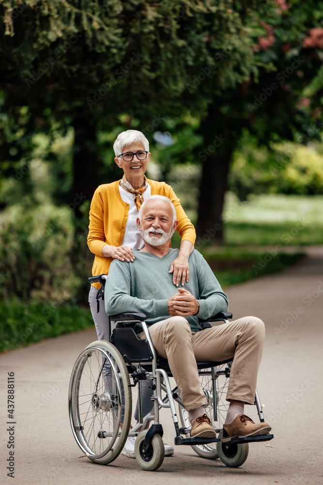 Happy senior woman, lovingly hugging her partner.