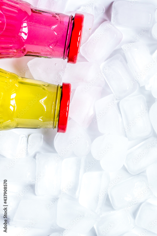 cold drinks in plastic bottles with ice white background top view mockup