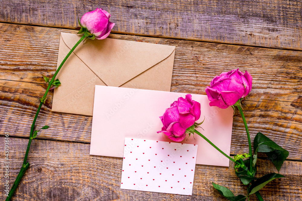 Mothers day gift with peony flowers, envelope and card top view mockup