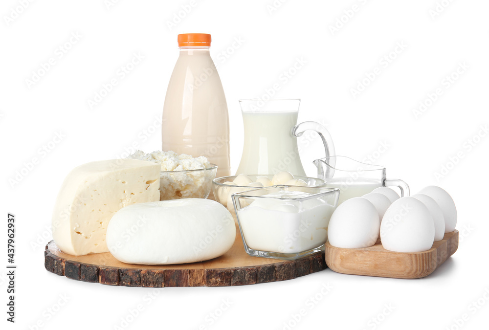 Different dairy products and chicken eggs on white background