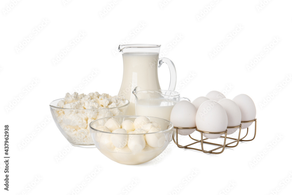 Different dairy products and chicken eggs on white background