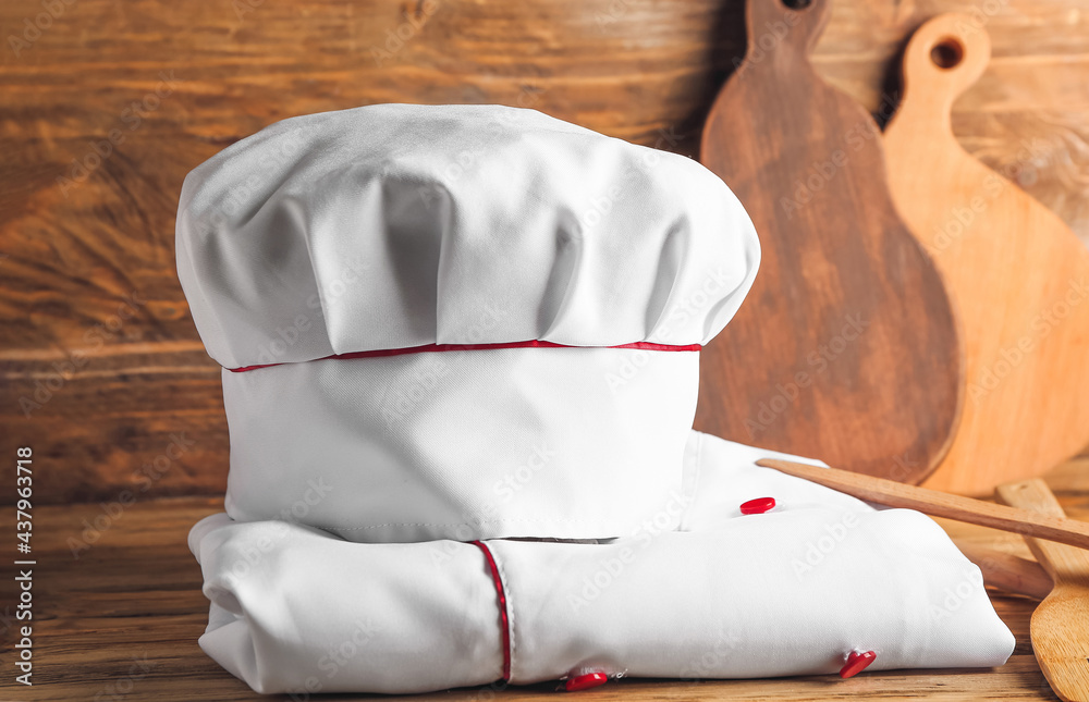 Chefs uniform on wooden background