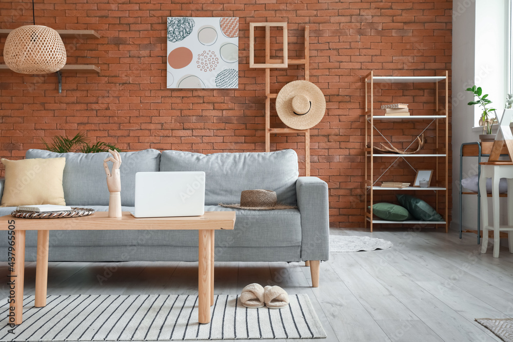 Stylish interior of living room with cozy sofa