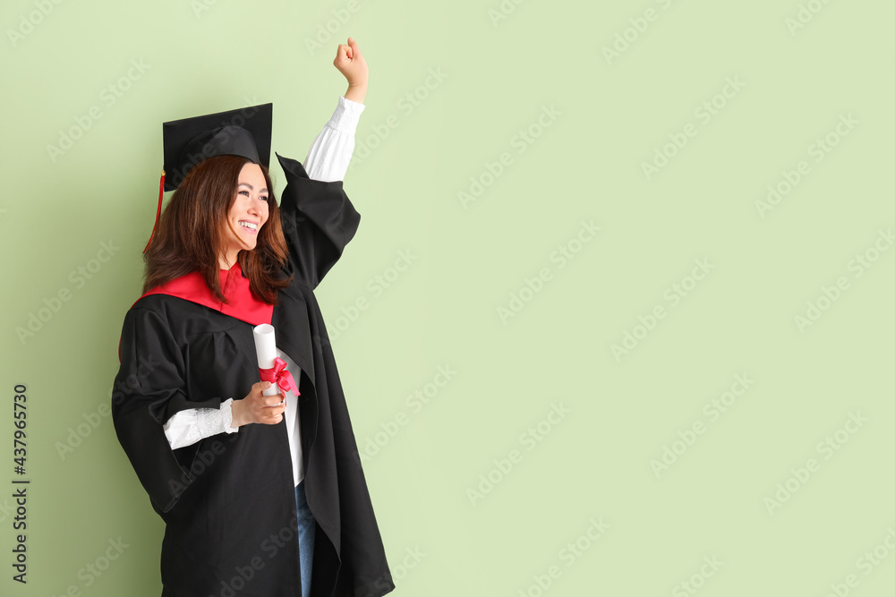 Happy female graduating student with diploma on color background