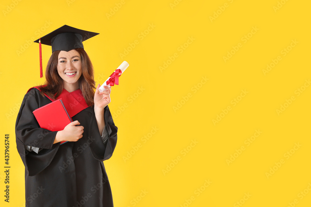 Female graduating student with diploma and books on color background