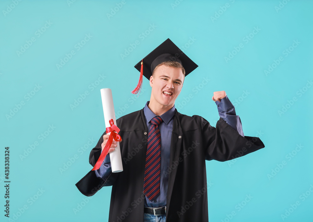 Happy graduating student on color background