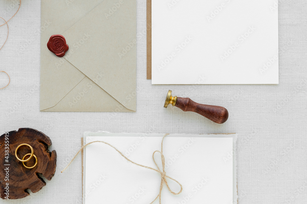 White paper notes and envelope on fabric textured background