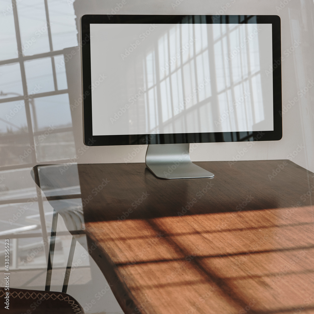 Computer screen on a wooden table