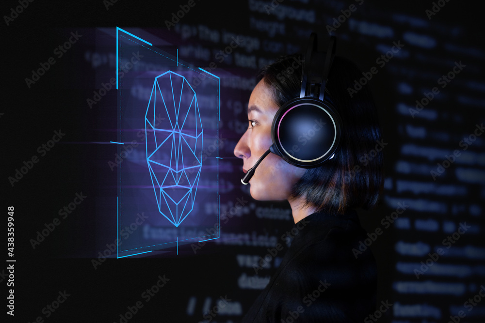 Female programmer scanning her face with biometric security technology on virtual screen digital rem