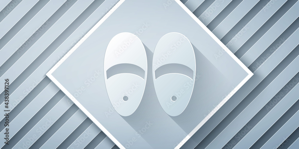 Paper cut Slippers icon isolated on grey background. Flip flops sign. Paper art style. Vector