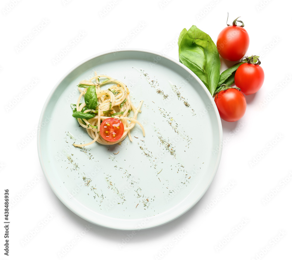 Plate with tasty pasta and tomatoes on white background