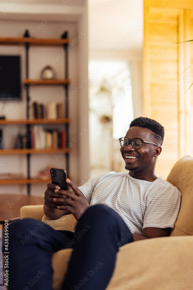 Adult man, enjoying his free time on the phone.