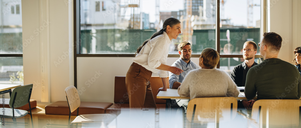 Entrepreneur talking in staff meeting