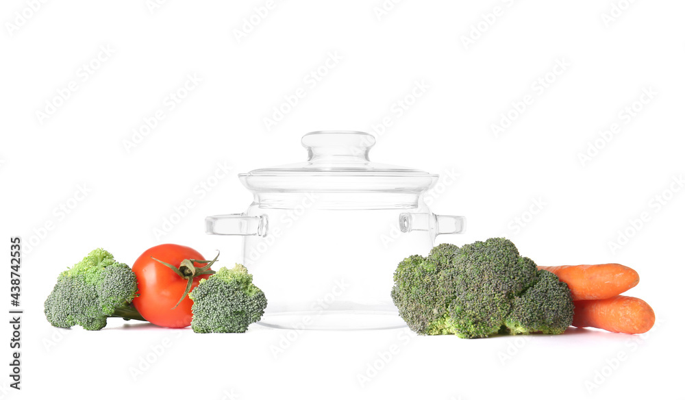 Stylish cooking pot and vegetables on white background