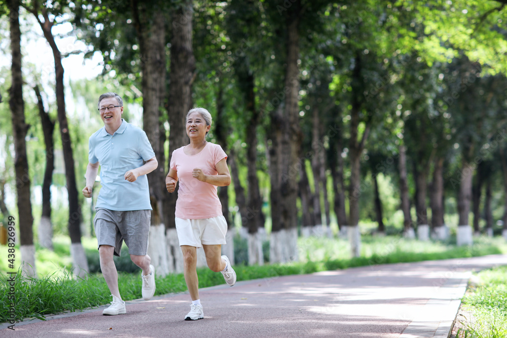 Old couple jogging in outdoor park