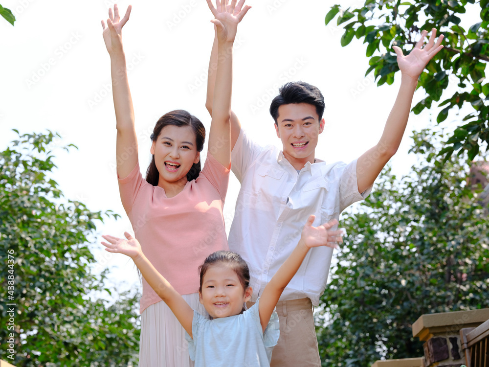 Happy family of three in the outdoor group photo