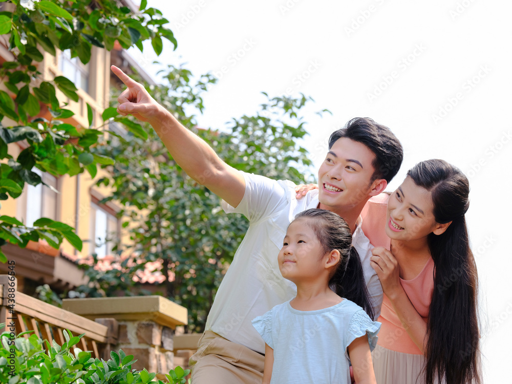 Happy family of three in the outdoor group photo