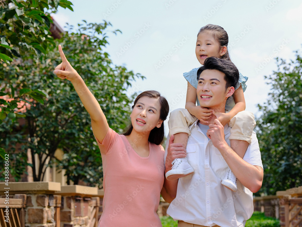 Happy family of three in the outdoor group photo