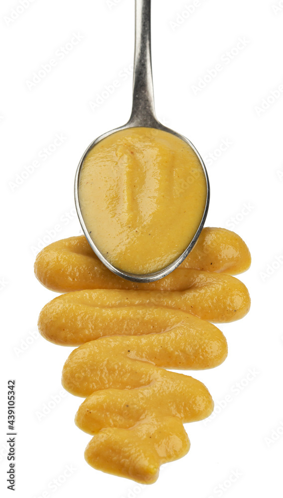 Spoon of mustard sauce isolated on white