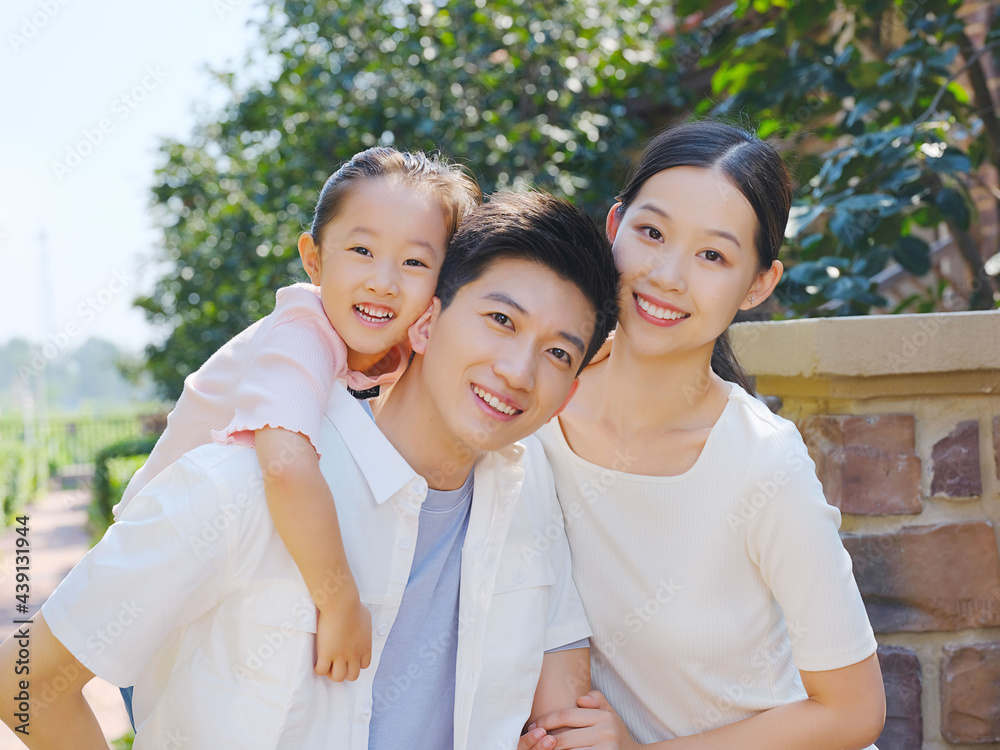 Happy family of three in the outdoor group photo