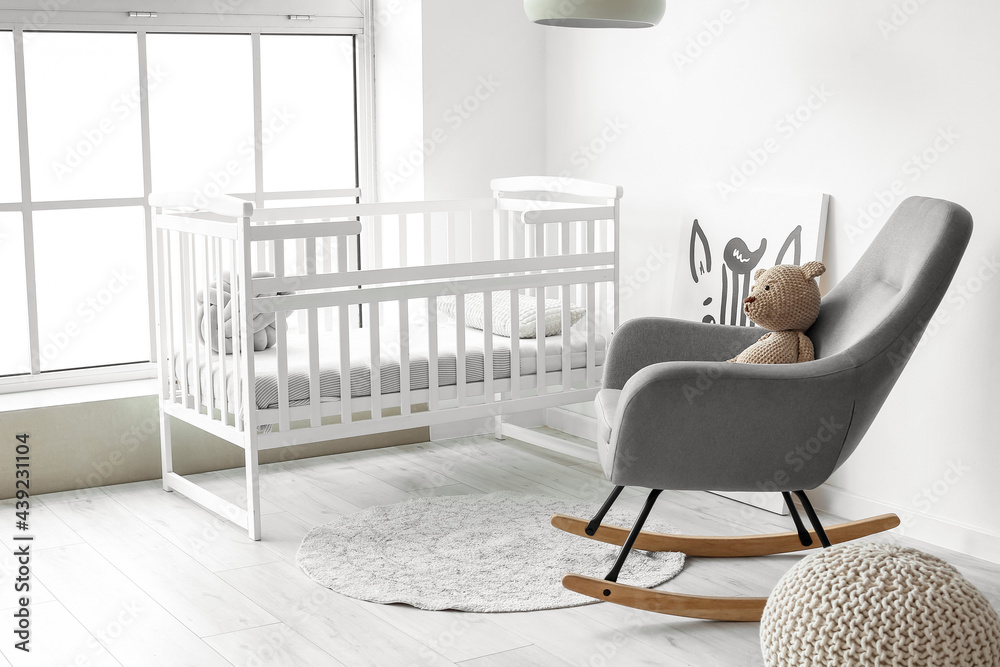 Interior of stylish childrens room with modern armchair