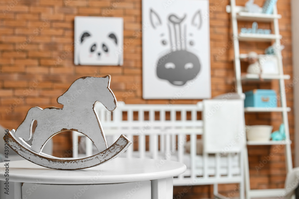 Decorative wooden horse in childrens room, closeup