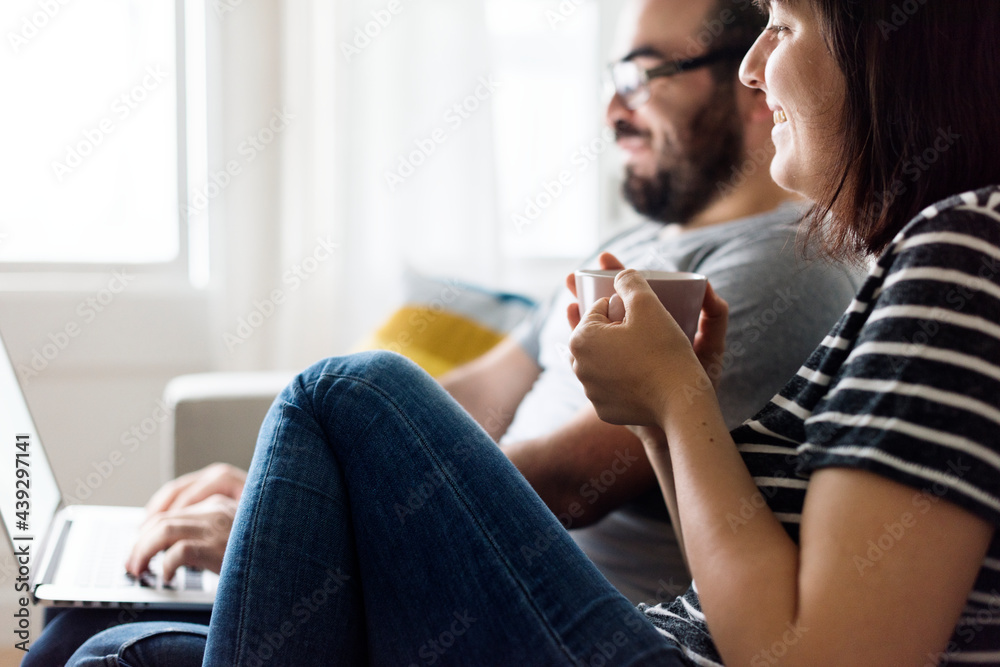 Happy couple relaxing at home