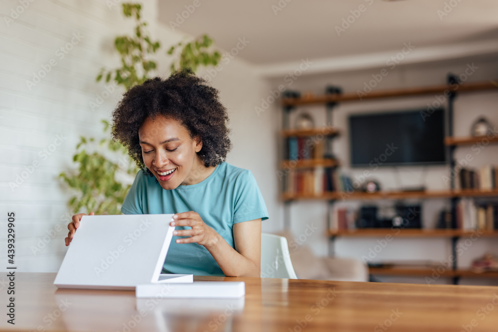 Adult woman, checking to see if anything is broken.