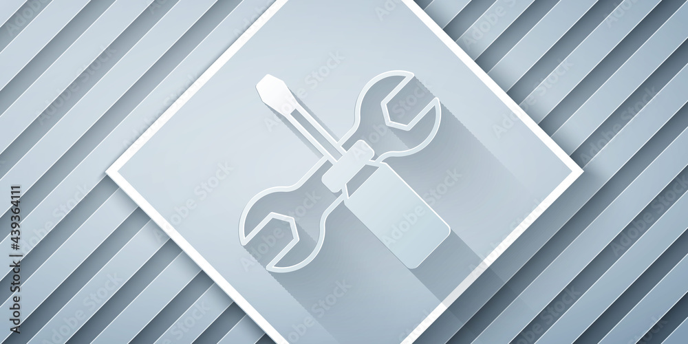 Paper cut Screwdriver and wrench spanner tools icon isolated on grey background. Service tool symbol