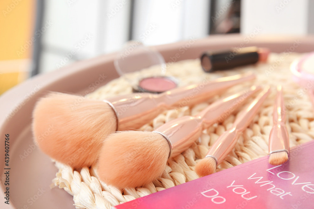 Tray with set of makeup brushes, closeup