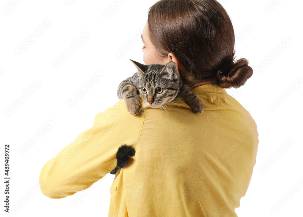 Young woman with cute cat on white background