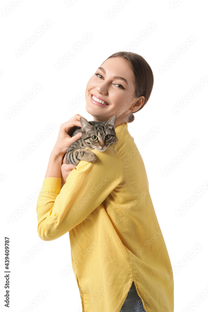 Beautiful young woman with cute cat on white background