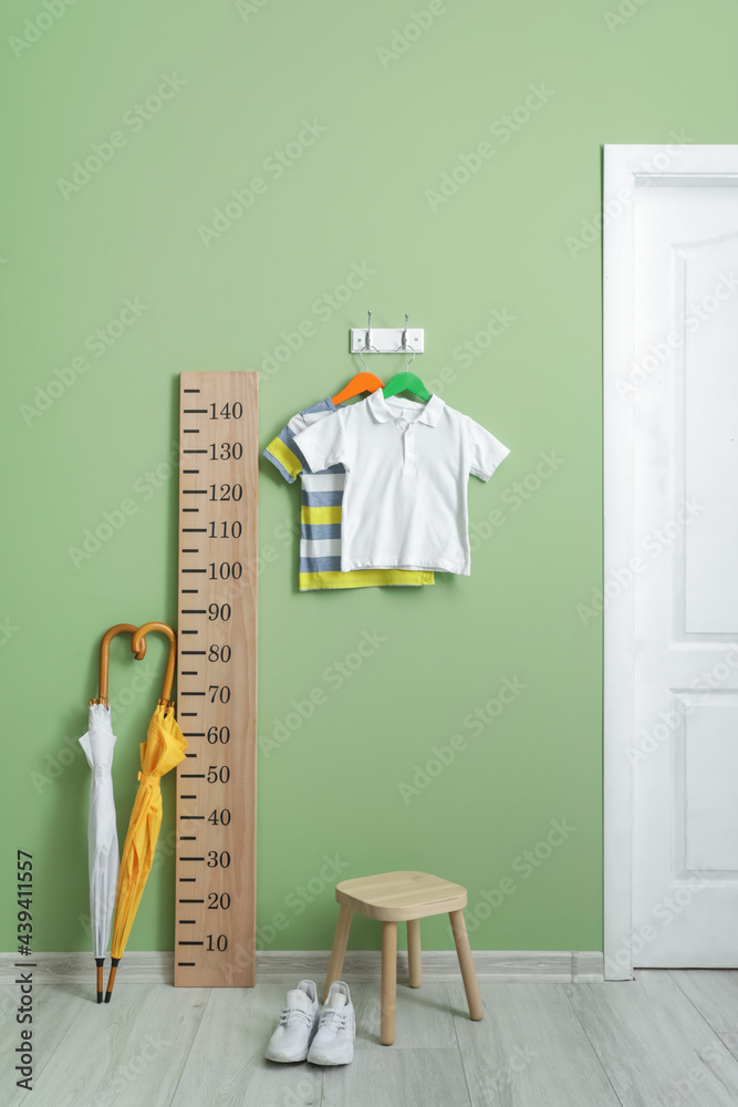 Stylish interior of modern childrens room with stadiometer