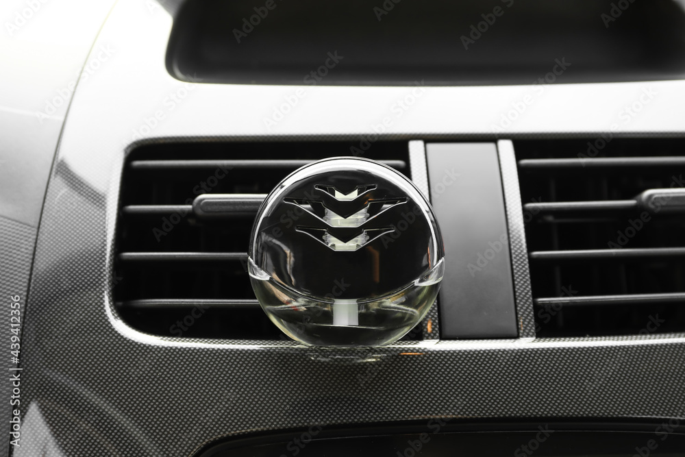 Air freshener hanging in car, closeup