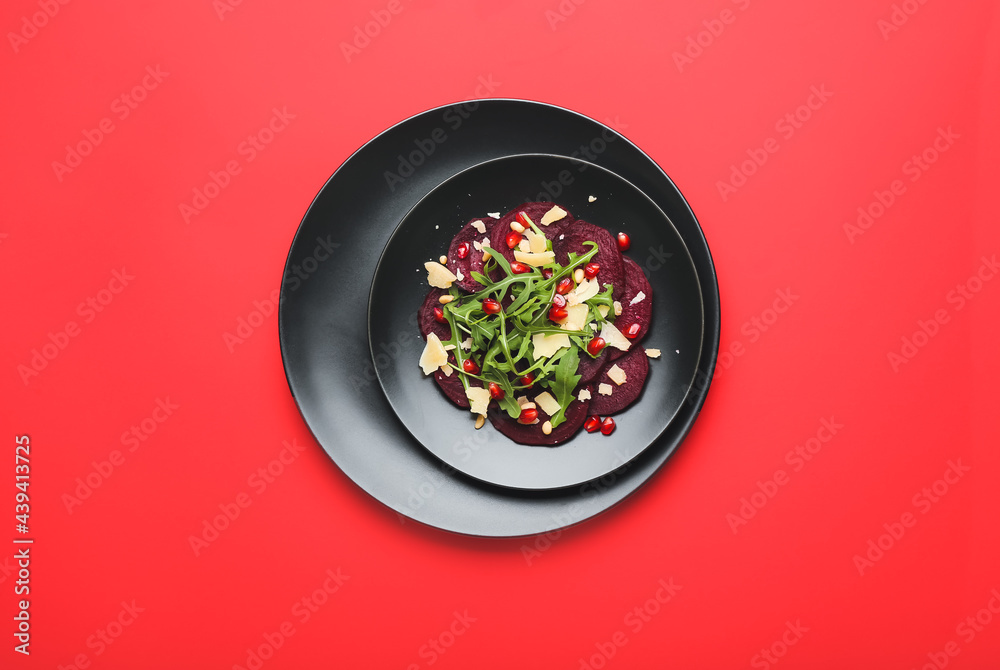 Plate with delicious beetroot carpaccio on color background