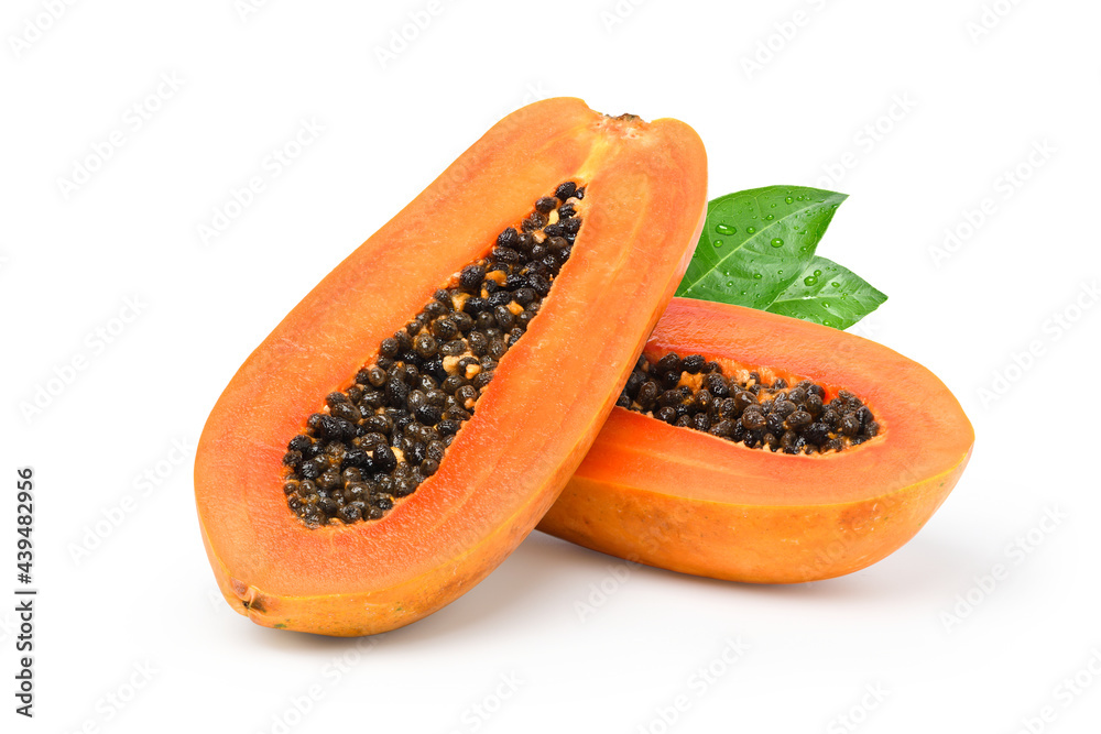 Ripe papaya cut in half isolated on white background.