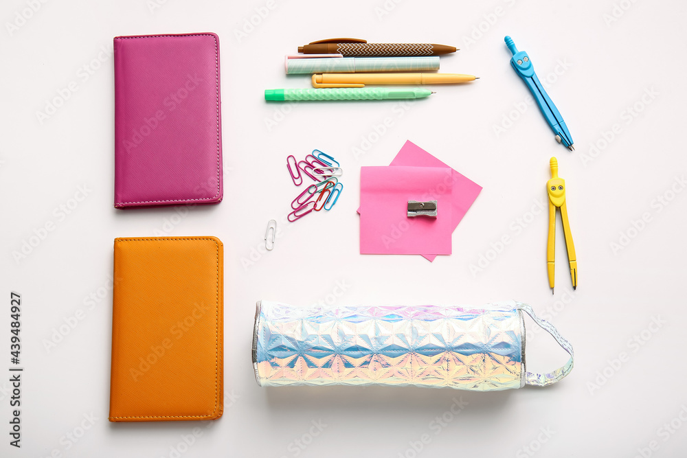 Pencil case with stationery on white background