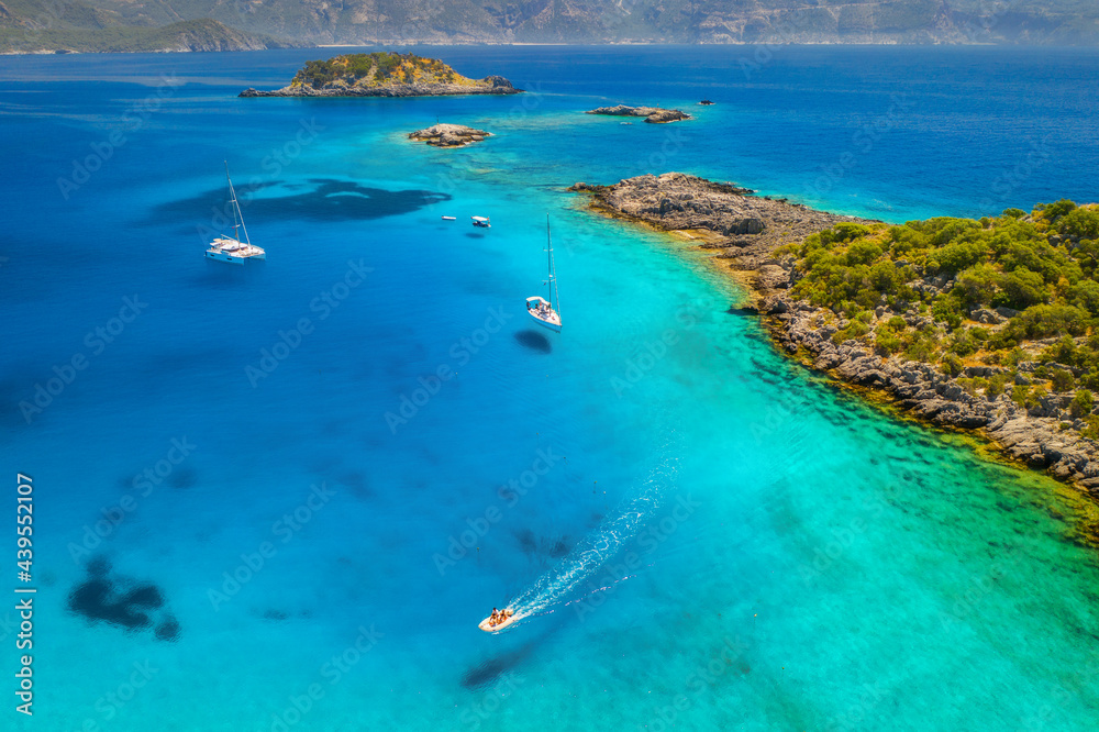 Aerial view of beautiful yachts and boats on the sea at sunset in summer. Akvaryum koyu in Turkey. T