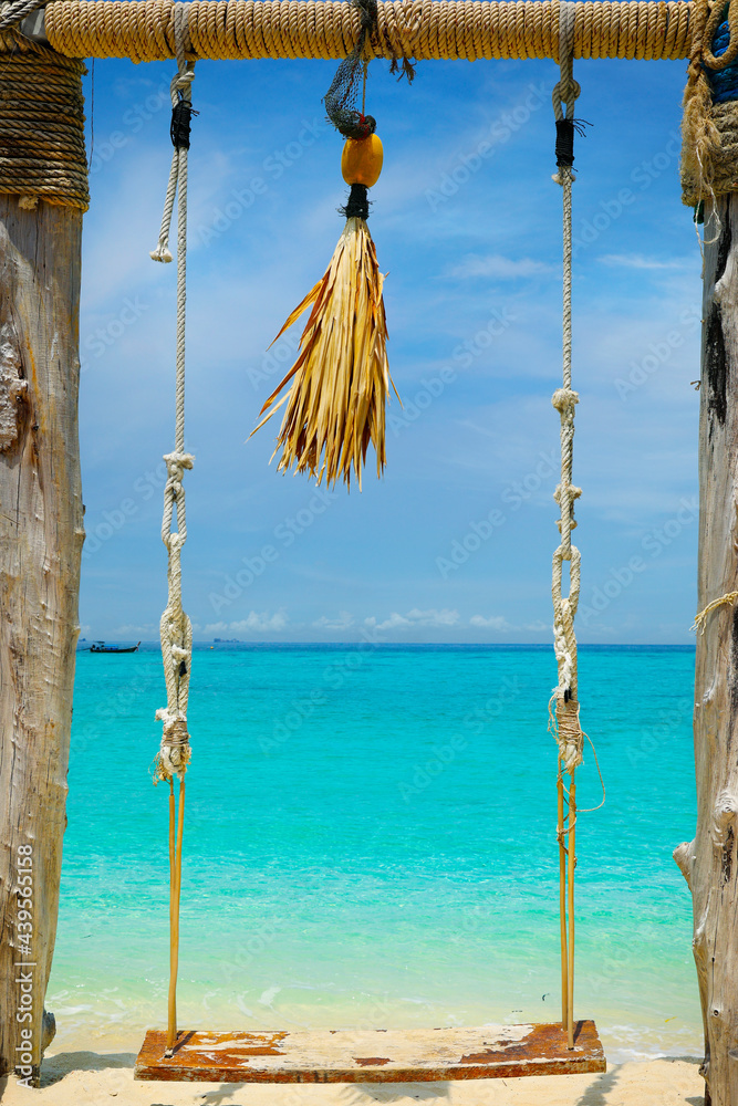 swing on white sand beach in the  andaman sea  in thailand